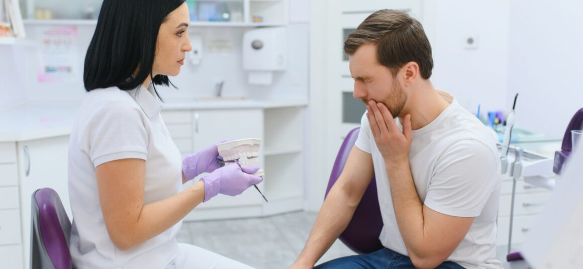 Man visiting dentist for tooth sensitivity - Midland Bay Dental.