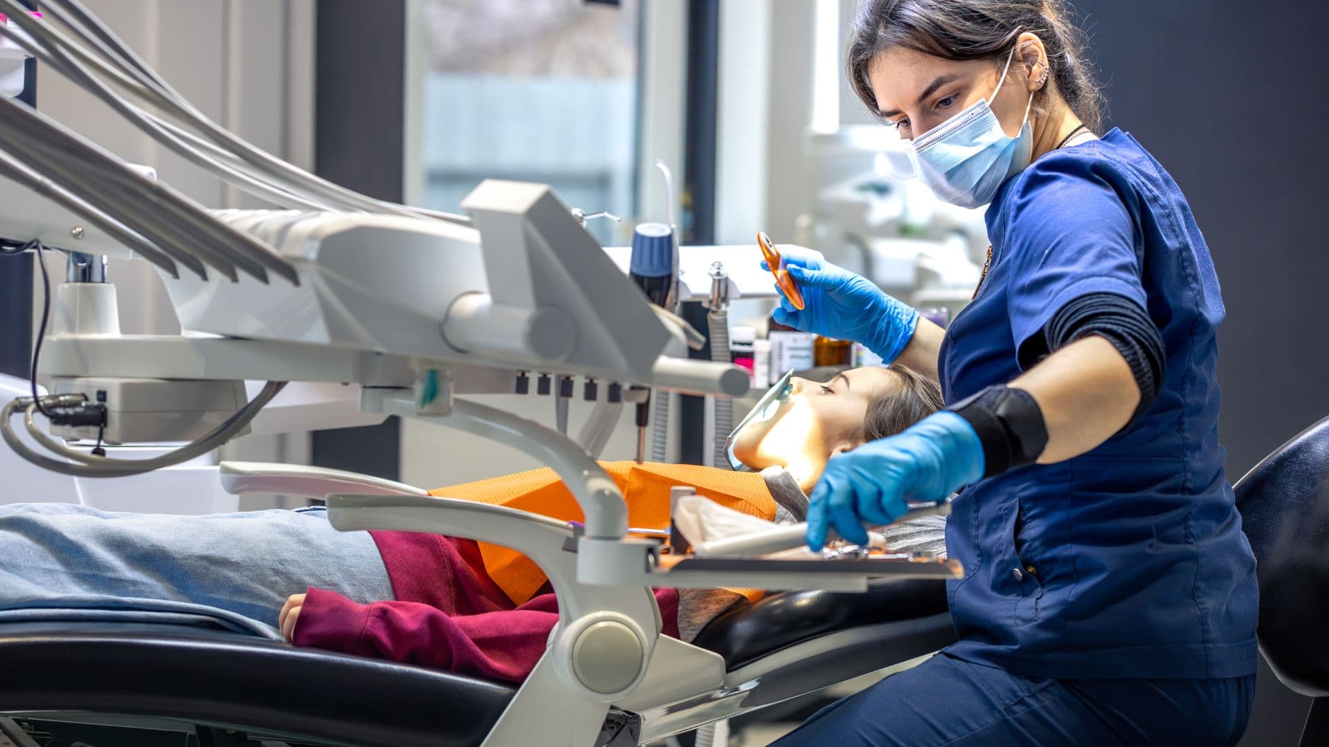 Female patient having wisdom teeth exam - wisdom teeth removal with Midland Bay Dental.