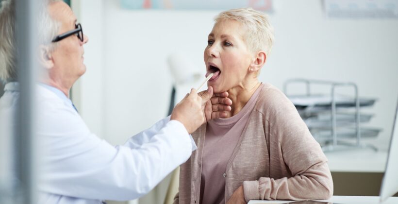 Woman getting checked by dentist - dry mouth at night - Midland Bay Dental.